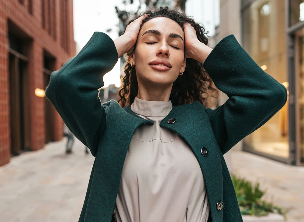 woman with green trenchcoat | Raj Dedhia MD San Francisco, CA