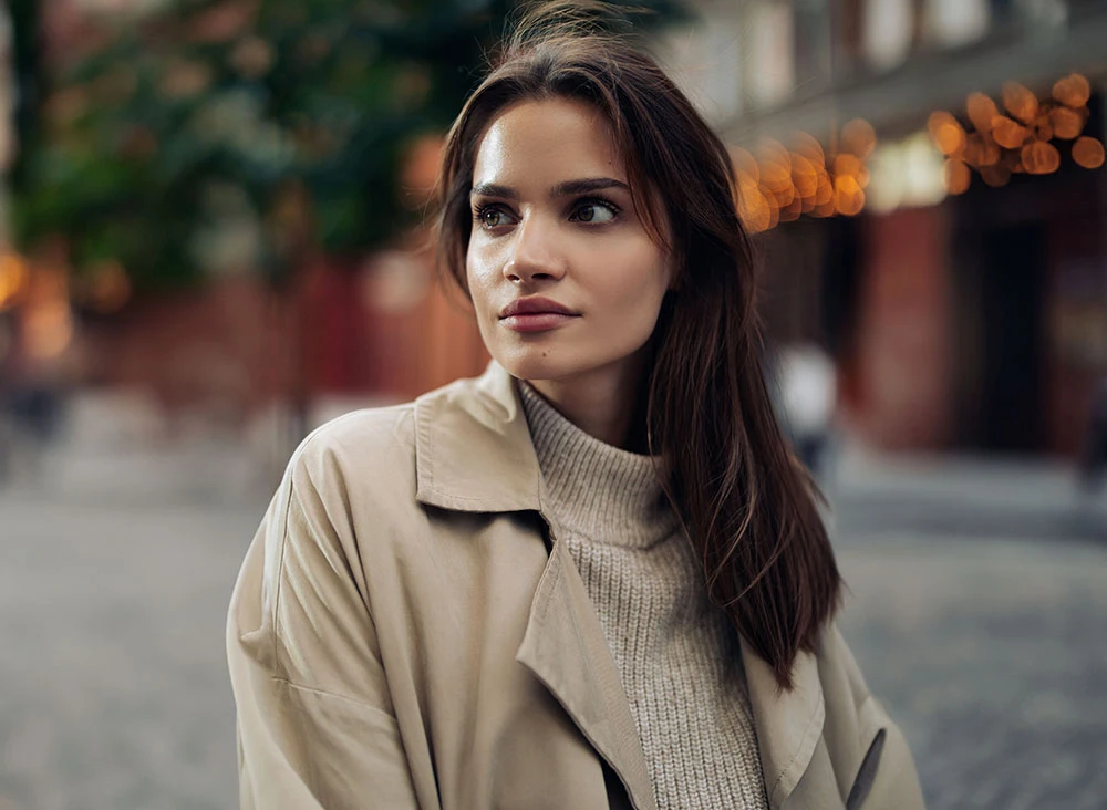 city woman in a trench coat and turtle neck | Raj Dedhia MD San Francisco, CA