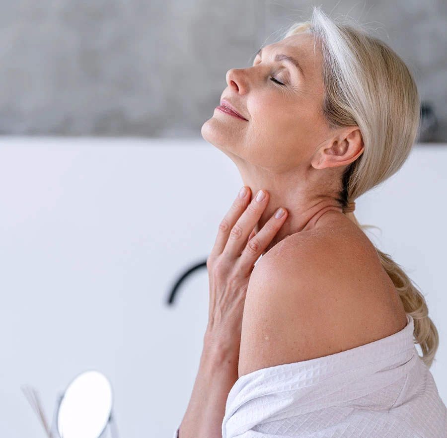 older woman looking up exposing her neck | Raj Dedhia MD San Francisco, CA