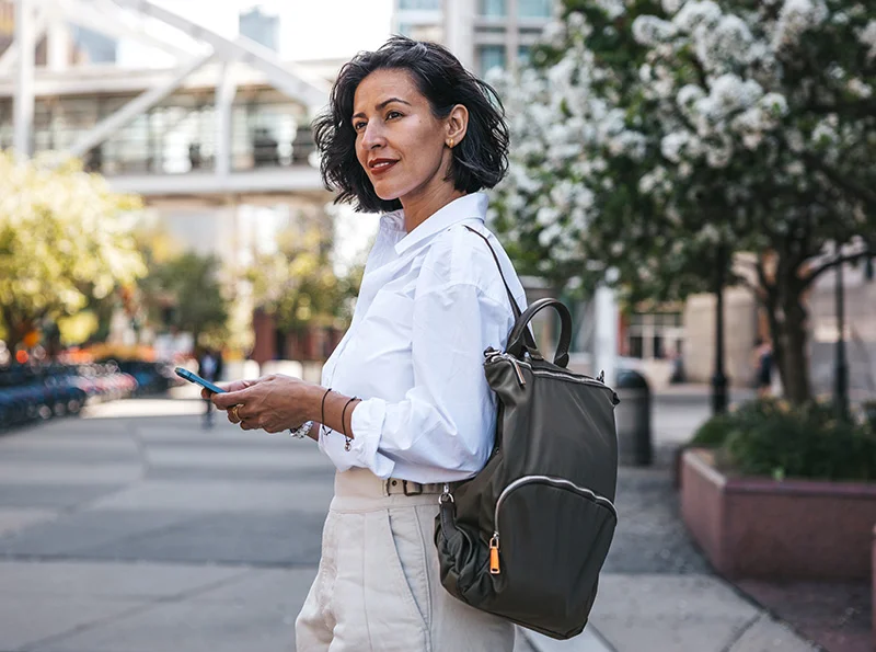 older woman walking out in the city | Raj Dedhia MD San Francisco, CA