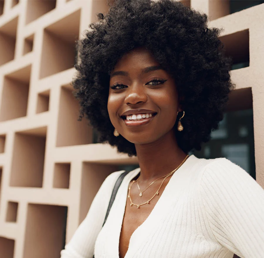 black woman smiling with a nice sweater | Raj Dedhia, MD San Francisco